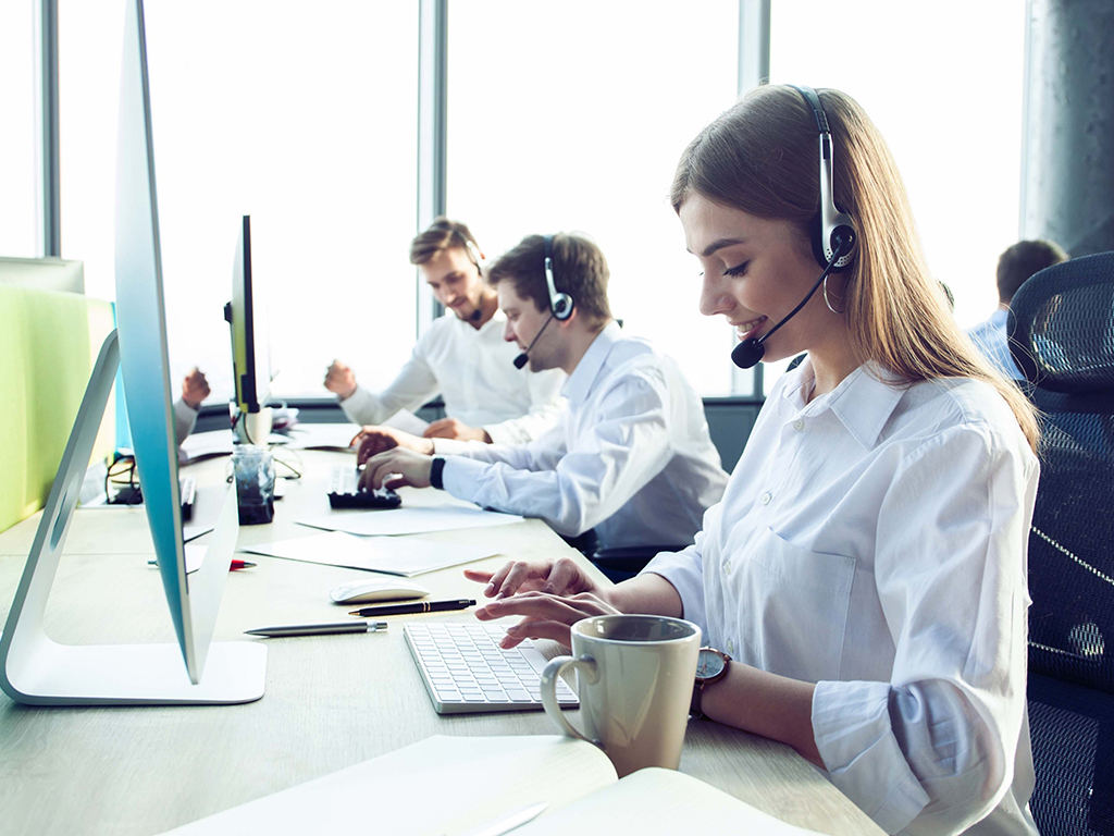 A row of reshored call center workers in the United States
