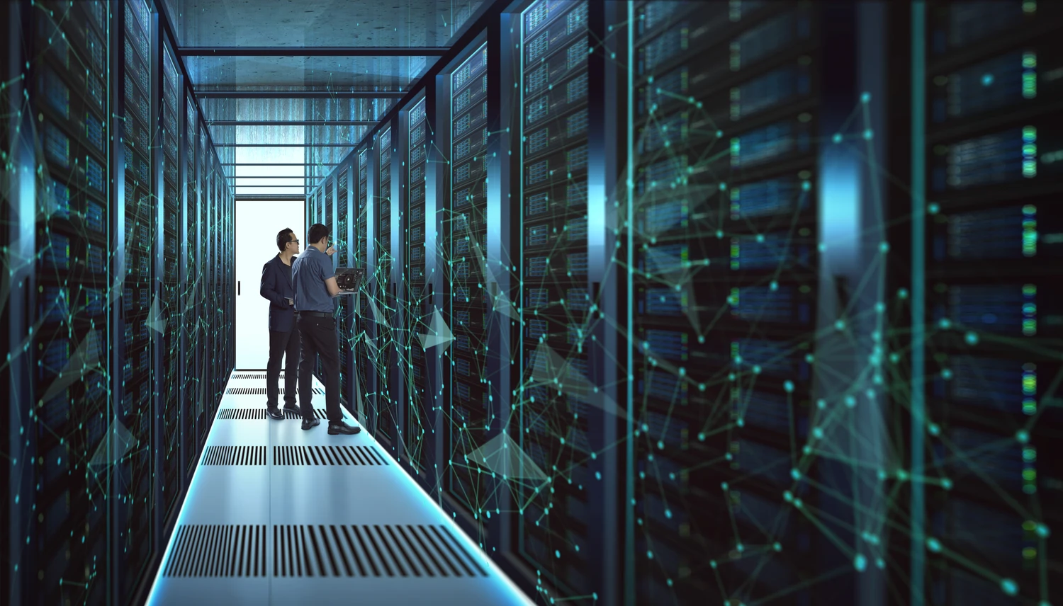 Two employees reviewing data center infrastructure